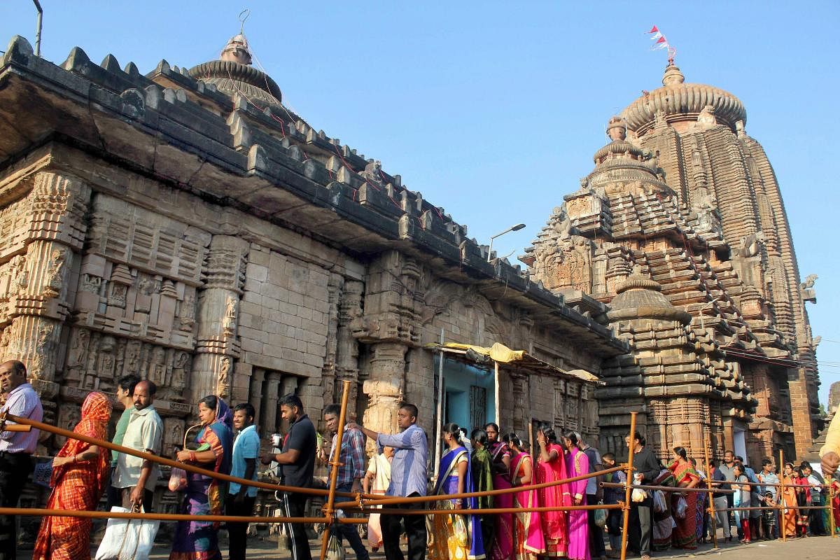 Devotees stand in a long queue to offer prayers at Lord Lingaraj temple on the occasion of Hindu festival of 'Maha Shivaratri' in Bhubaneswar on Wednesday. Credit: PTI Photo