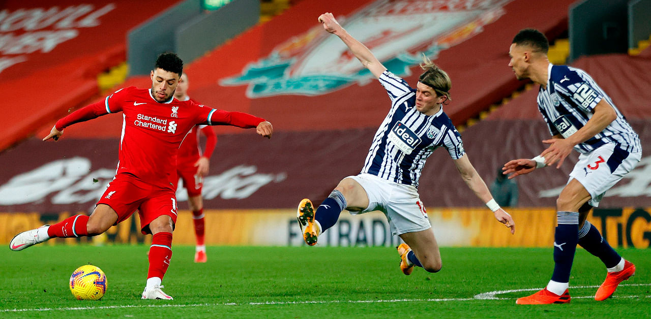 Liverpool's English midfielder Alex Oxlade-Chamberlain shoots but fails to score during the English Premier League football match between Liverpool and West Bromwich Albion at Anfield. Credit: AFP Photo