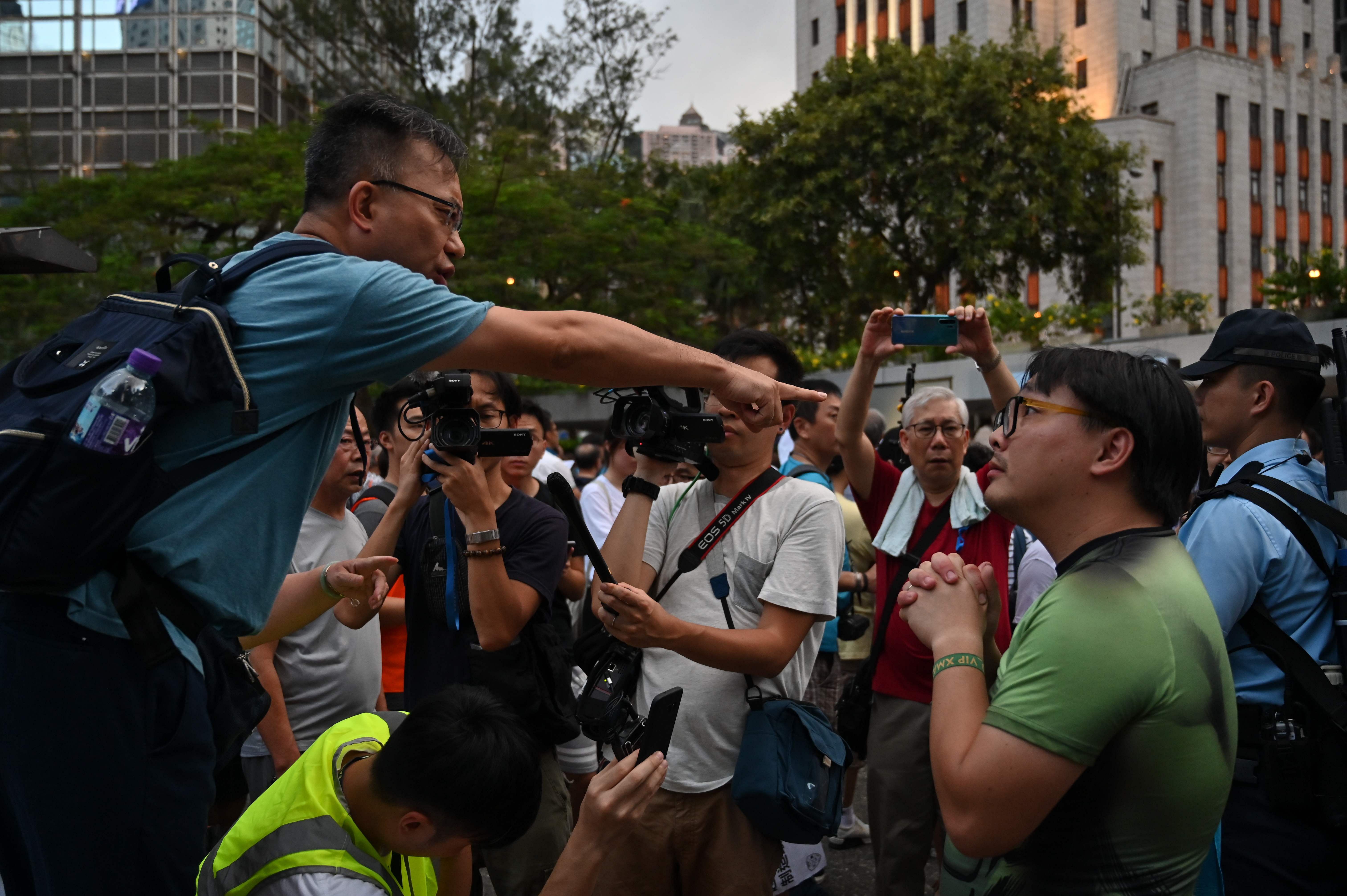 People attend a rally to show their support to the local police force in Honk Kong in Hong Kong on June 22, 2019. - Hong Kong police on June 22 slammed anti-government protesters for besieging their headquarters, calling the demonstration "illegal and irrational" as they vowed to pursue the ringleaders. Credit: AFP Photo