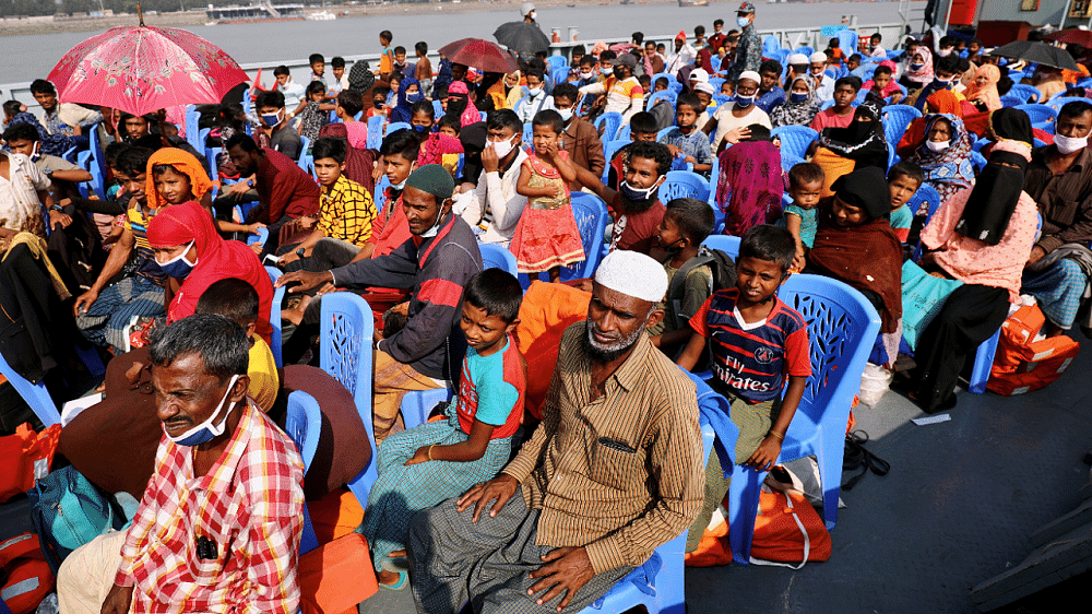 Rohingya refugees are seen aboard a ship as they are moved to Bhasan Char island, Bangladesh. Credit: Reuters Photo