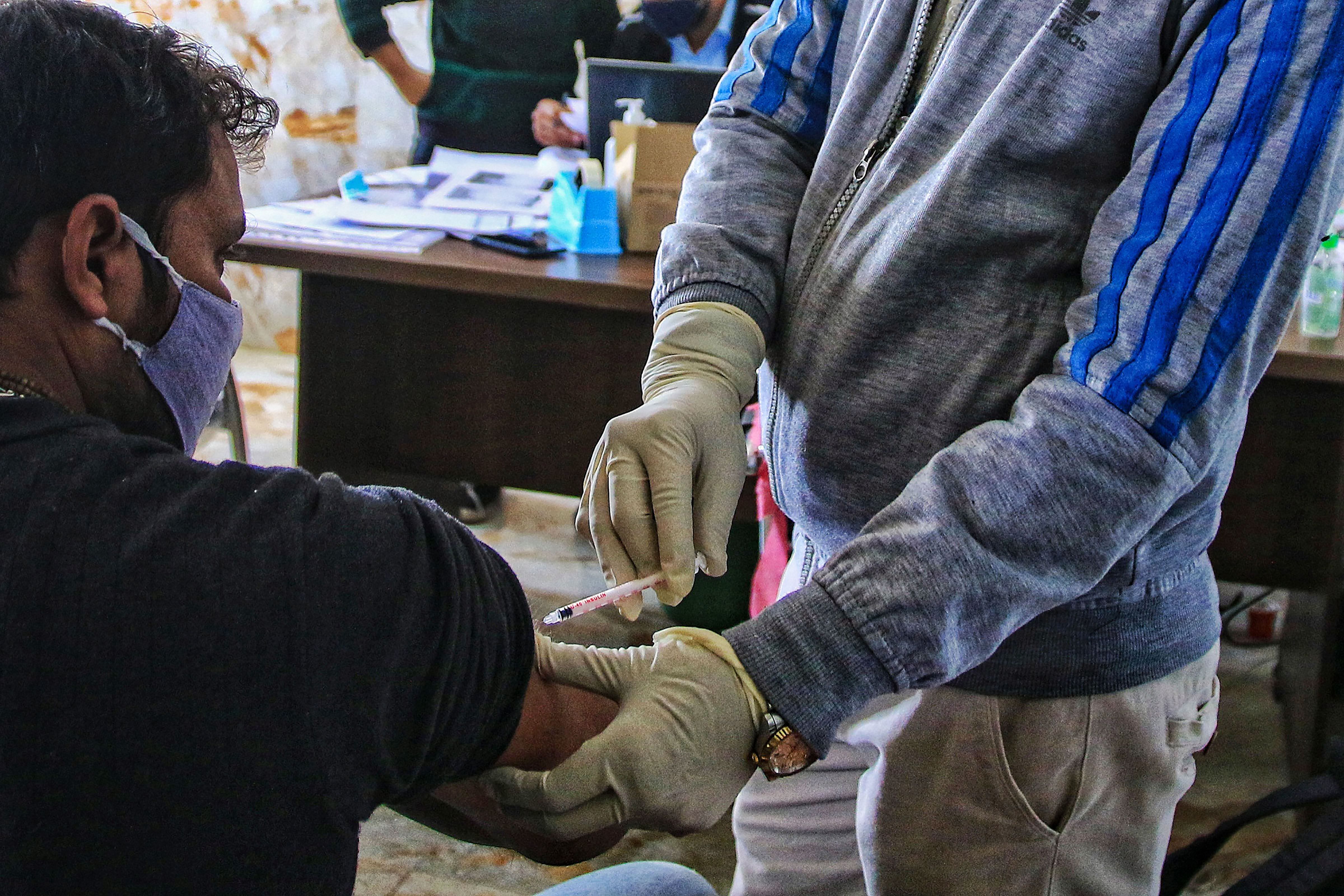  A volunteer being vaccinated by a medic during the Bharat Biotech's 'Covaxin'. Credit: PTI Photo