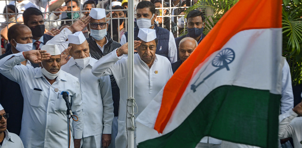 Madhya Pradesh State Congress Unit President Kamal Nath and other leaders during the flag hoisting ceremony on party's 136th foundation day at PCC Headquaters in Bhopal. Credit: PTI Photo
