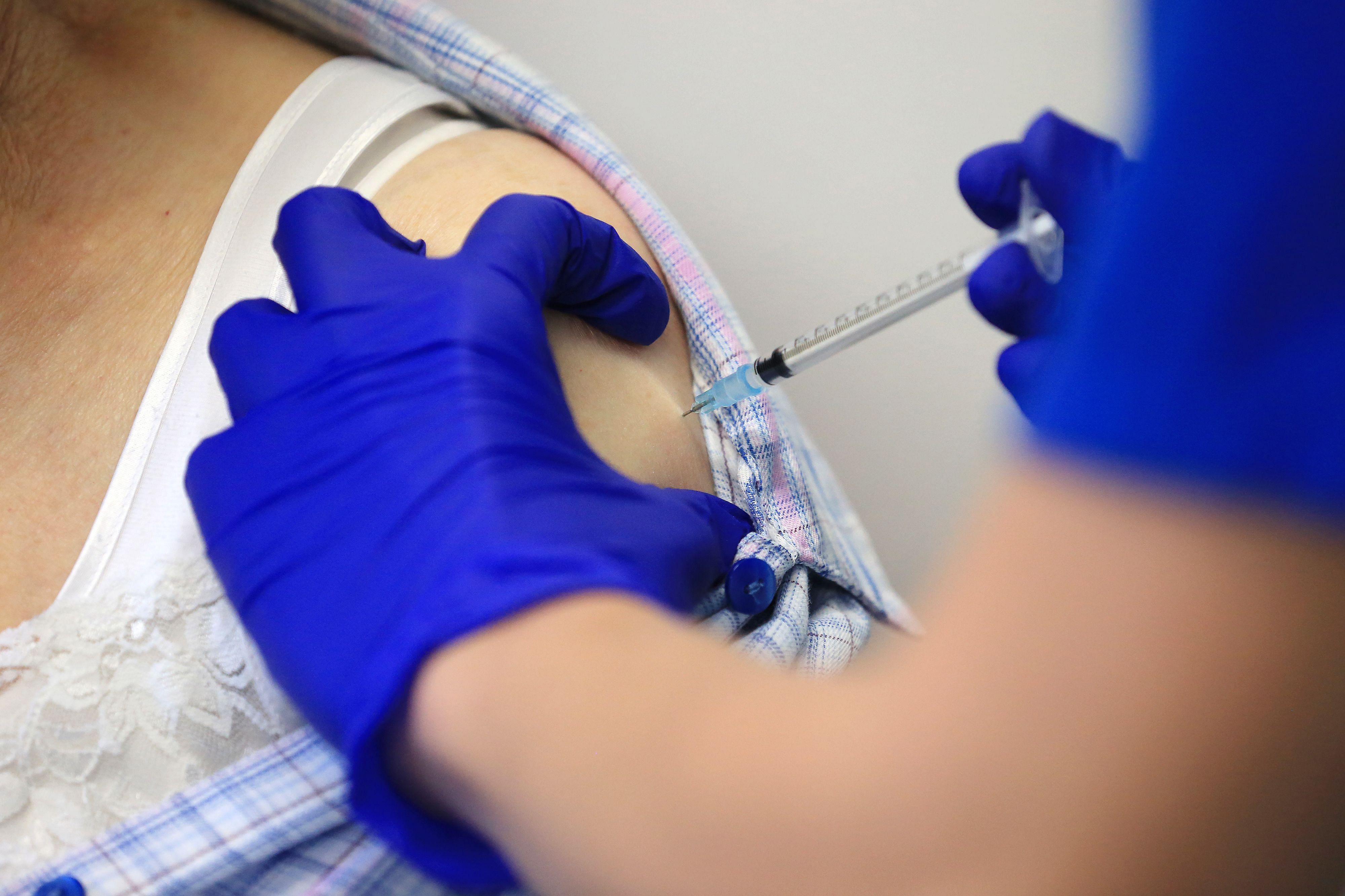 Nurse Practitioner Terri Welch administers a dose of the Pfizer-BioNTech Covid-19 vaccine. Credit: AFP Photo