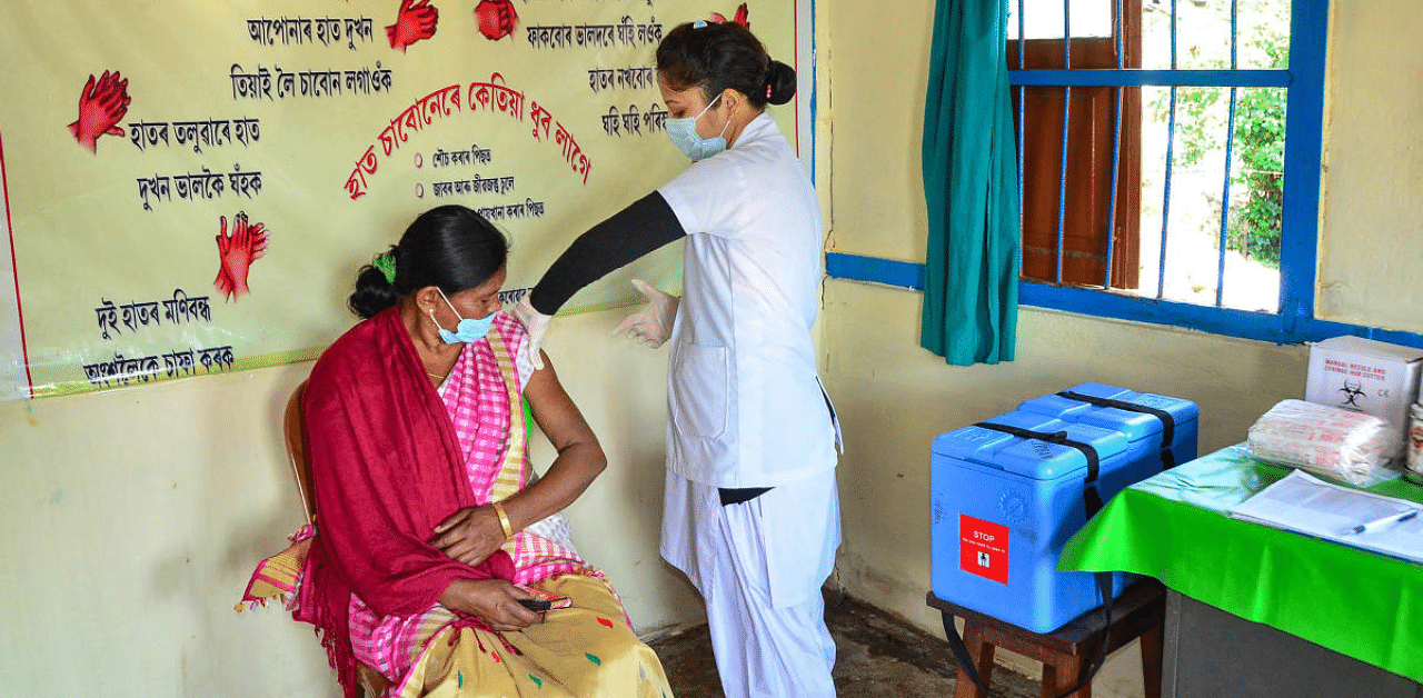 A medic demonstrates administration of COVAXIN to a health worker during its trials, at the Urban Primary Health Centre at Tezpur in Sonitpur district, Assam. Credit: PTI Photo