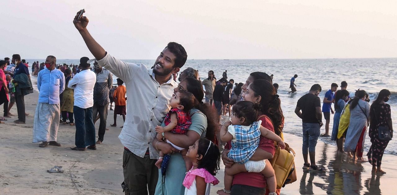  People, not wearing face masks, visit Kochi Beach amid coronavirus pandemic, in Kochi. Credit: PTI Photo