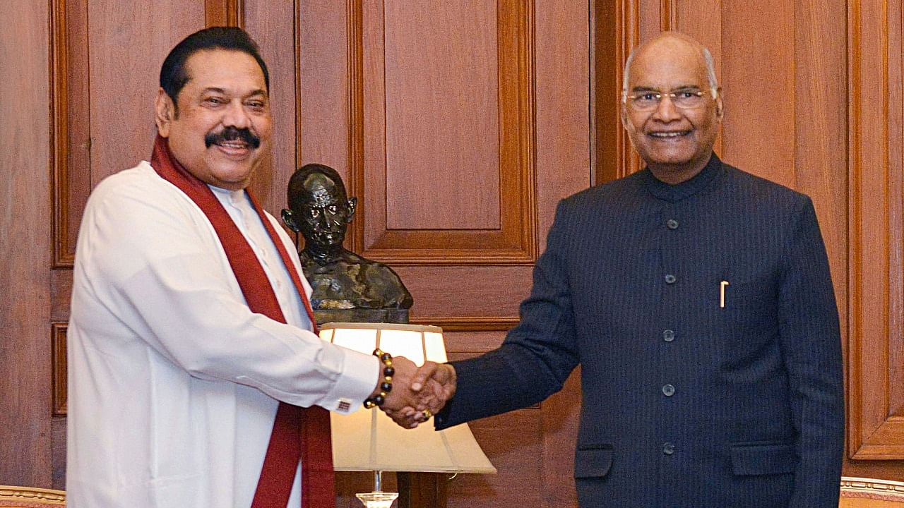 President Ram Nath Kovind shakes hands with Prime Minister of Sri Lanka Mahinda Rajapaksa during a meeting in New Delhi. Credit: PTI Photo