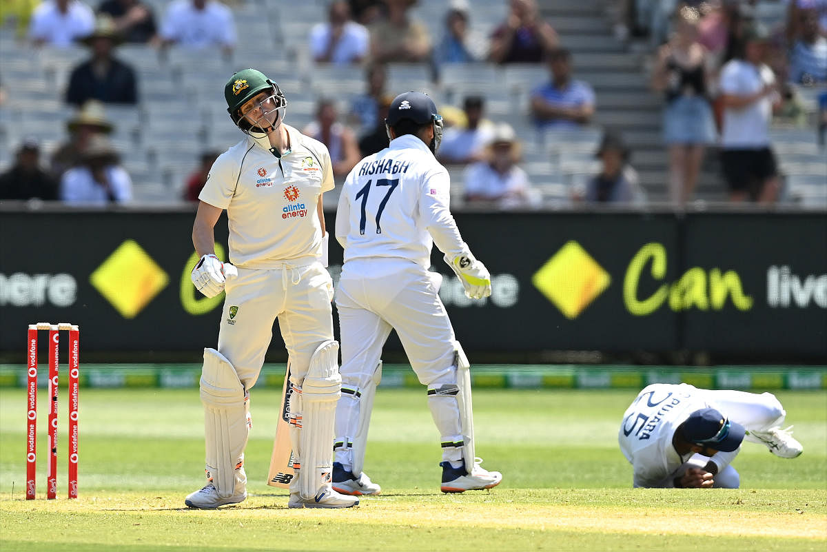 Australian's Steve Smith is caught by Cheteshwar Pujara off R Ashwin for a duck on the opening day of the second Test at the MCG. Credit: Getty images. 