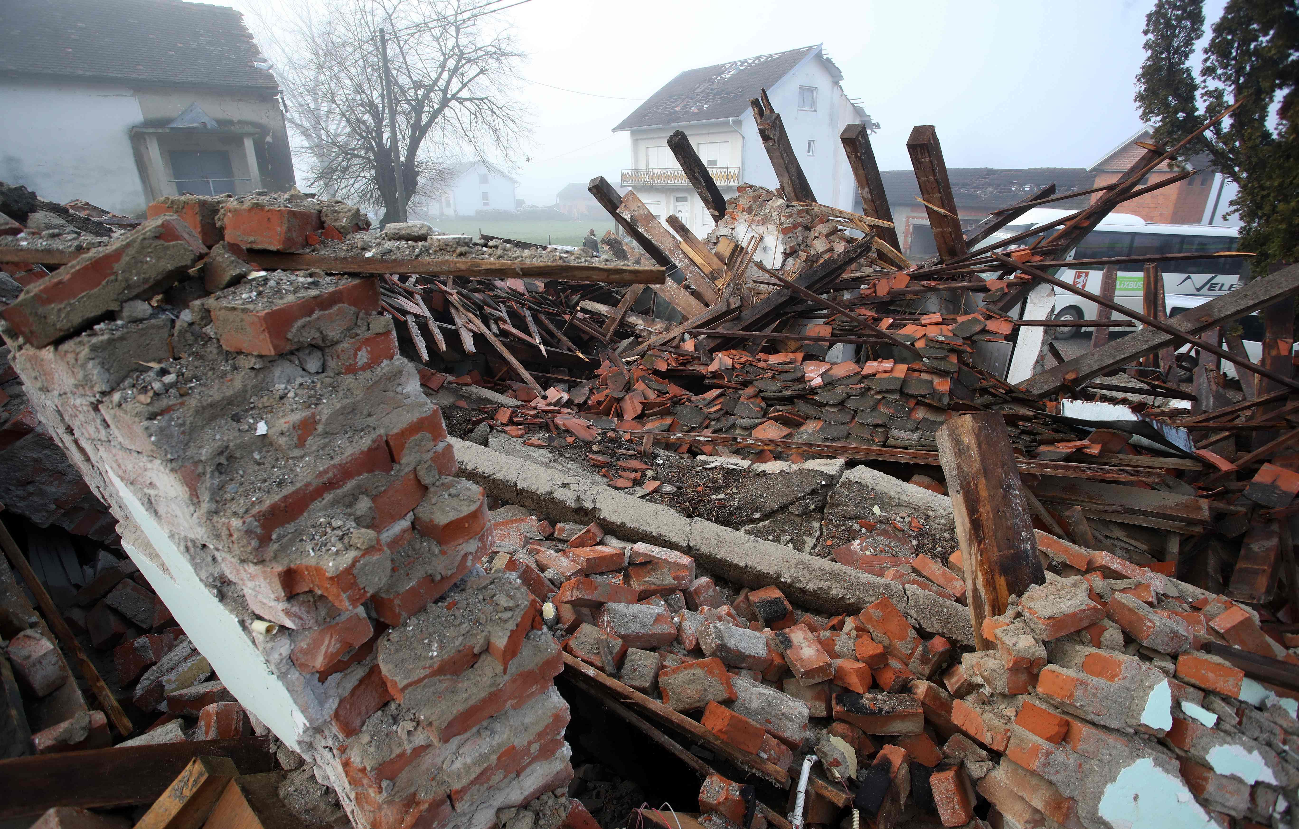   Picture taken on December 30, 2020 shows the rubble of a destroyed building in the village of Majske Poljane, where 5 people died, some 50kms from Zagreb, a day after the region was hit by a 6.4-magnitude quake. - Fresh tremors shook Croatia on on December 30, 2020 as the Adriatic country was still picking up the pieces of a deadly earthquake that claimed seven lives and reduced buildings to rubble the day before. The aftershocks jangled nerves in towns south of Zagreb where the quake left gaping holes in buildings and crushed cars under mountains of bricks. Credit: AFP Photo
