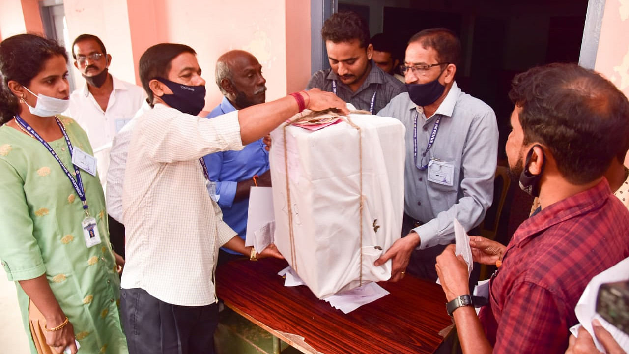The ballot box is being opened by the officials in the presence of candidates and their agents at Mahathma Gandhi Centenary Composite PU College in Bondel. Credit: DH Photo