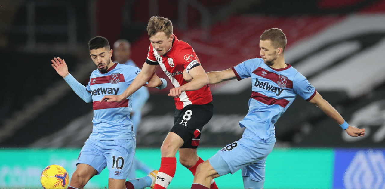 West Ham United's Manuel Lanzini and Tomas Soucek in action with Southampton's James Ward-Prowse. Credit: Reuters