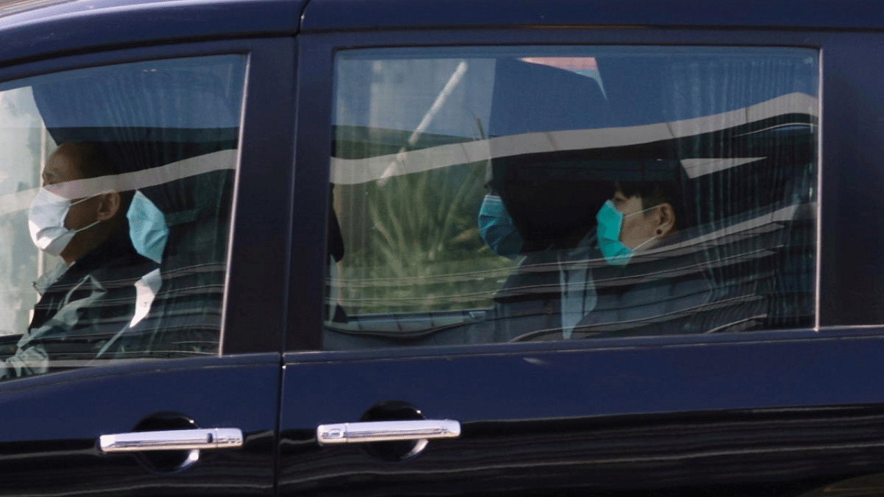 One of the 12 Hong Kong activists detained in mainland China over an illegal border crossing is seen in a vehicle after a transfer conducted at the China-Hong Kong border of Shenzhen Bay Port , in Hong Kong, China. Credit: Reuters