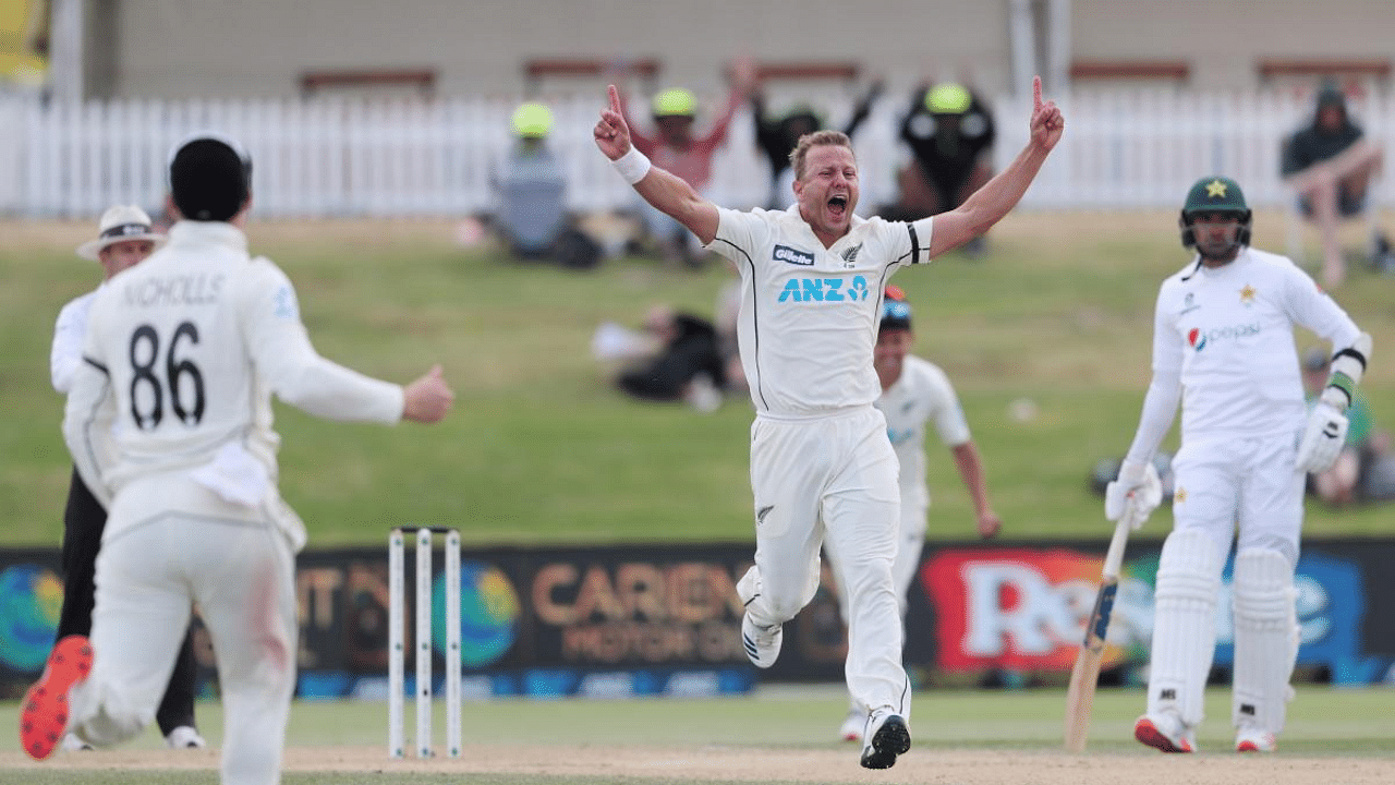 New Zealand’s Neil Wagner (C) celebrates after taking the wicket of Pakistan’s Faheem Ashraf (R) during the fifth day of the first cricket Test match between New Zealand and Pakistan at the Bay Oval in Mount Maunganui. Credit: AFP
