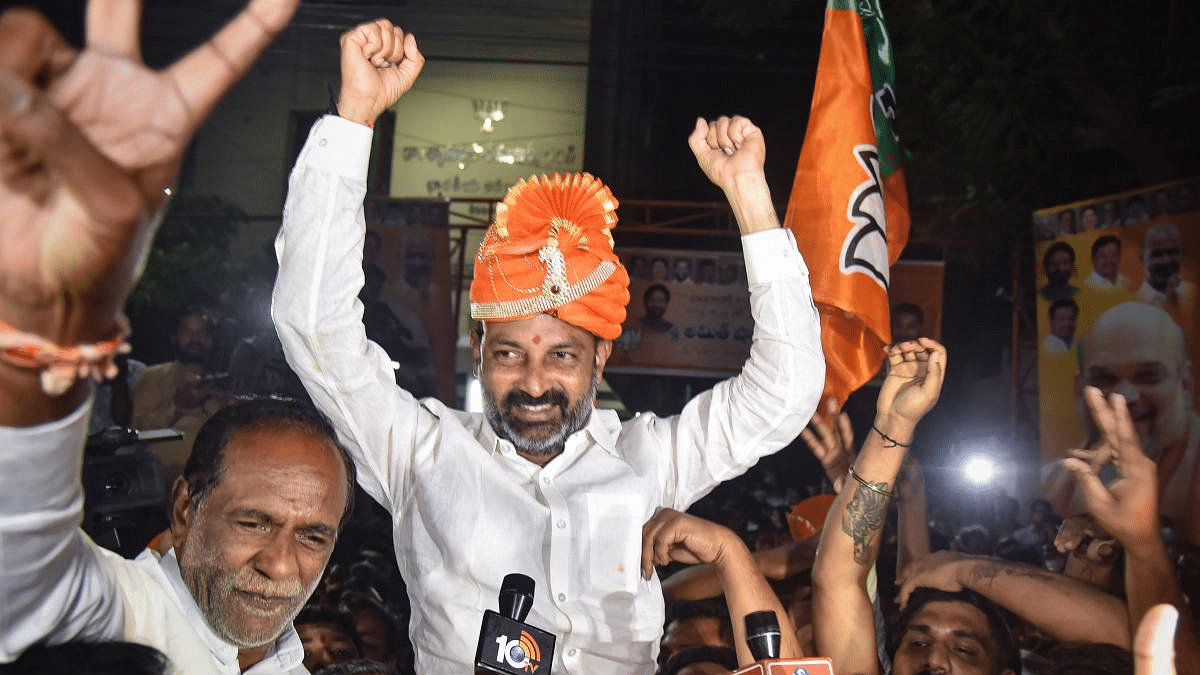 BJP State President Bandi Sanjay celebrates during the counting day of Greater Hyderabad Municipal Corporation (GHMC) elections, in Hyderabad. Credit: PTI File Photo