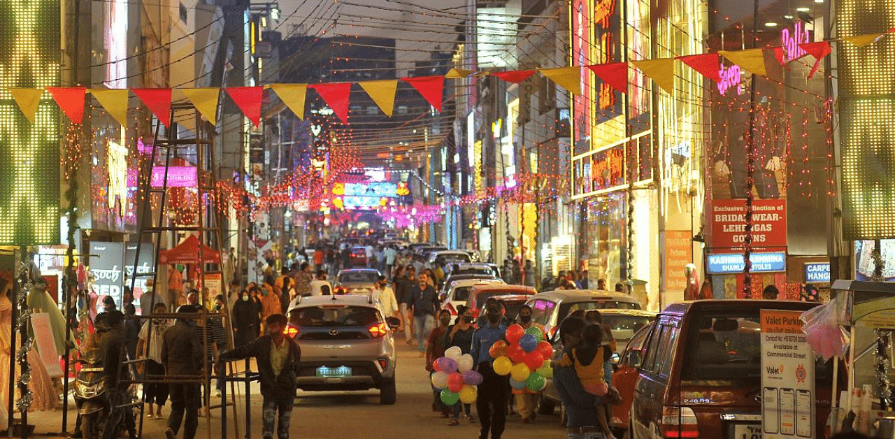 Commercial Street is lit up with colourful lights for New Year celebrations in Bengaluru on Wednesday. DH Photo/Pushkar V