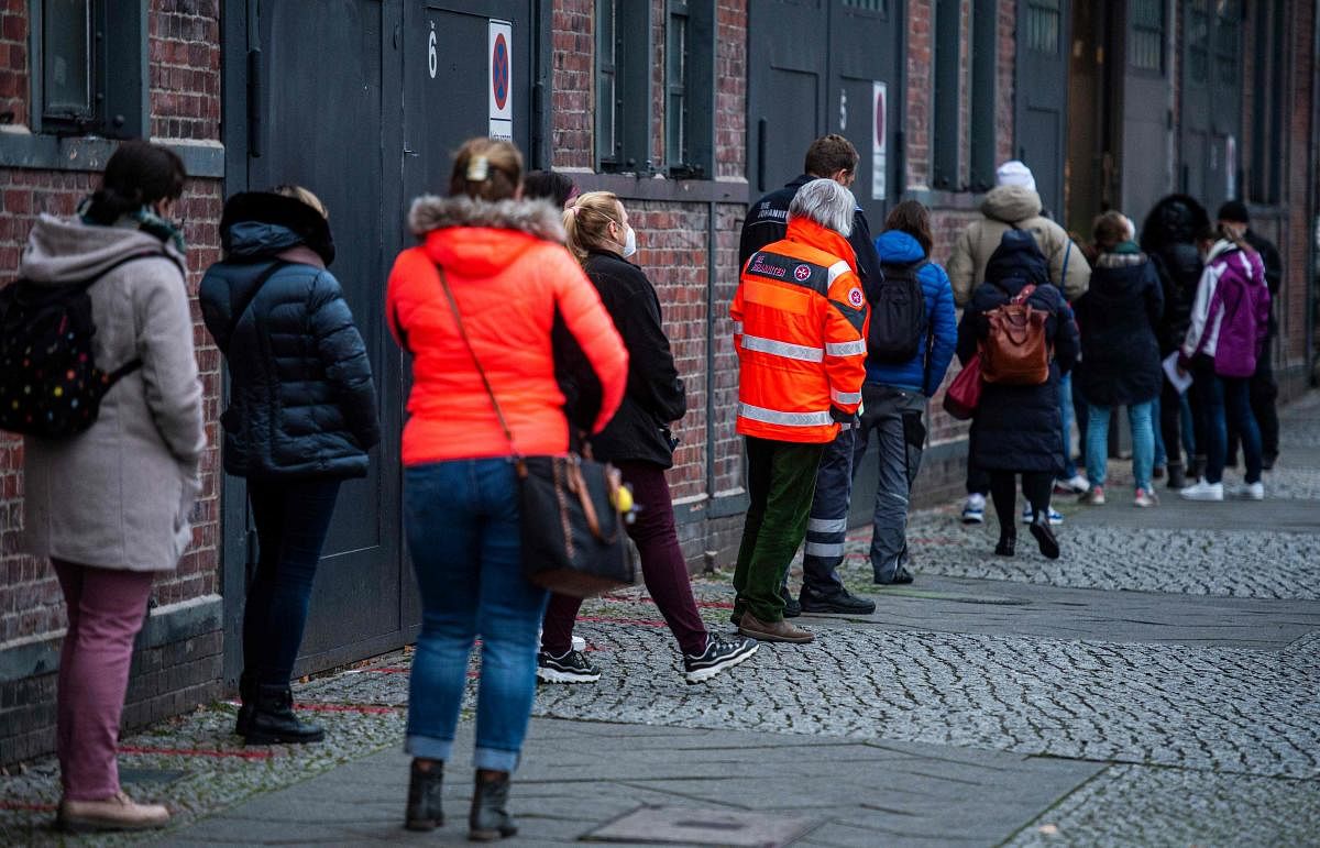 People queue in front of one of Berlin's 6 vaccination centres in Treptow, eastern Berlin, amid a Coronavirus Covid-19 pandemic. Credit: AFP. 