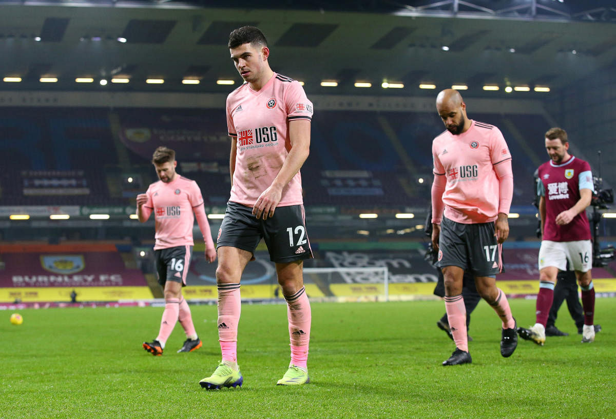 Sheffield United's John Egan and David McGoldrick looks dejected after the match. Credit: Reuters. 