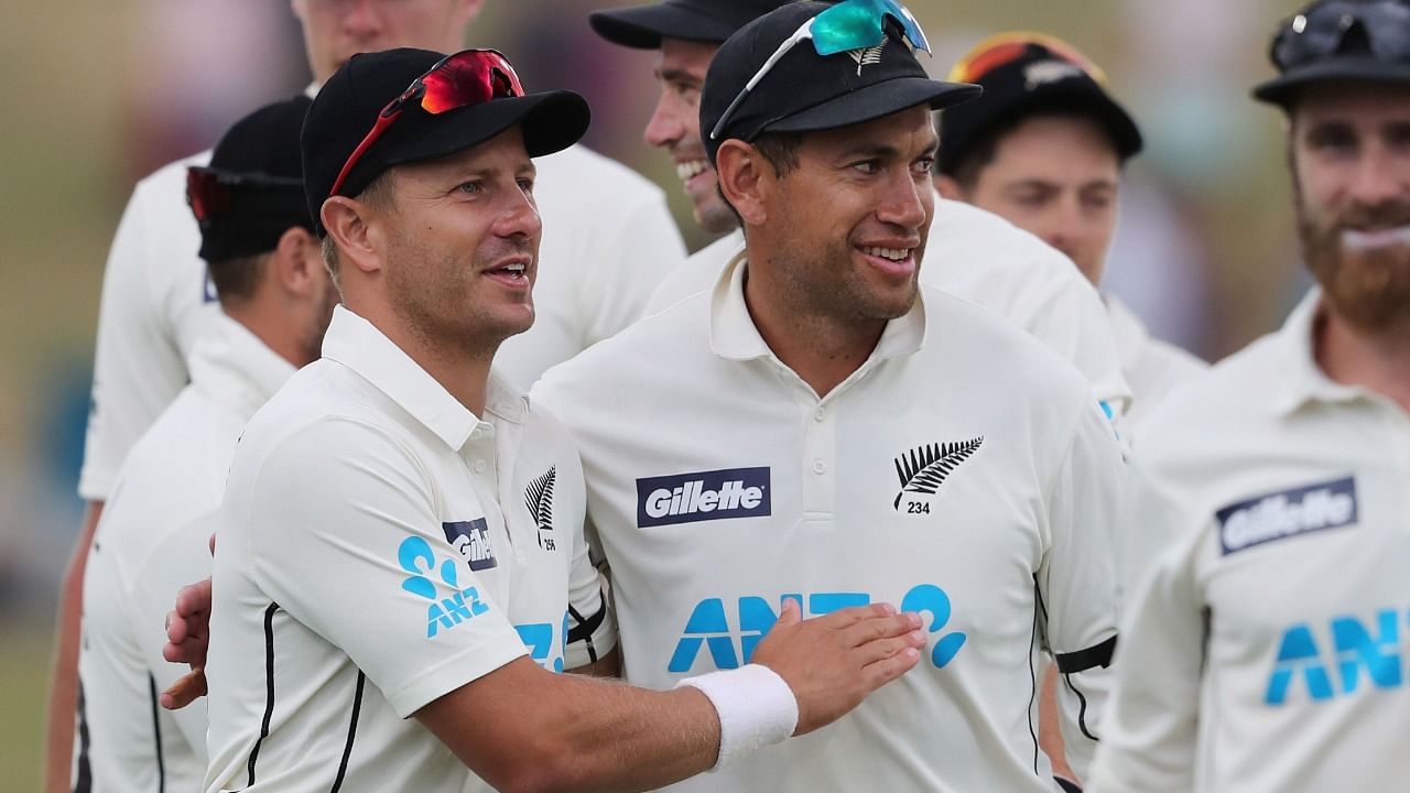 New Zealand’s Neil Wagner (L) and Ross Taylor (R) celebrate after winning on the fifth day of the first cricket Test match between New Zealand and Pakistan at the Bay Oval in Mount Maunganui on December 30, 2020. Credit: AFP Photo