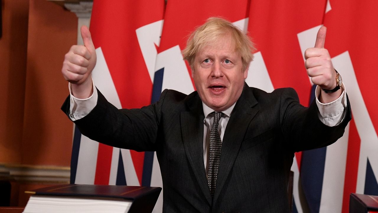 Britain's Prime Minister Boris Johnson gives a thumbs up after signing the Brexit trade deal with the EU at number 10 Downing Street in London. Credit: Reuters Photo