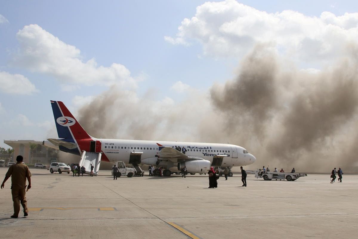 Dust rises after explosions hit Aden airport, upon the arrival of the newly-formed Yemeni government in Aden, Yemen. Credit: Reuters. 
