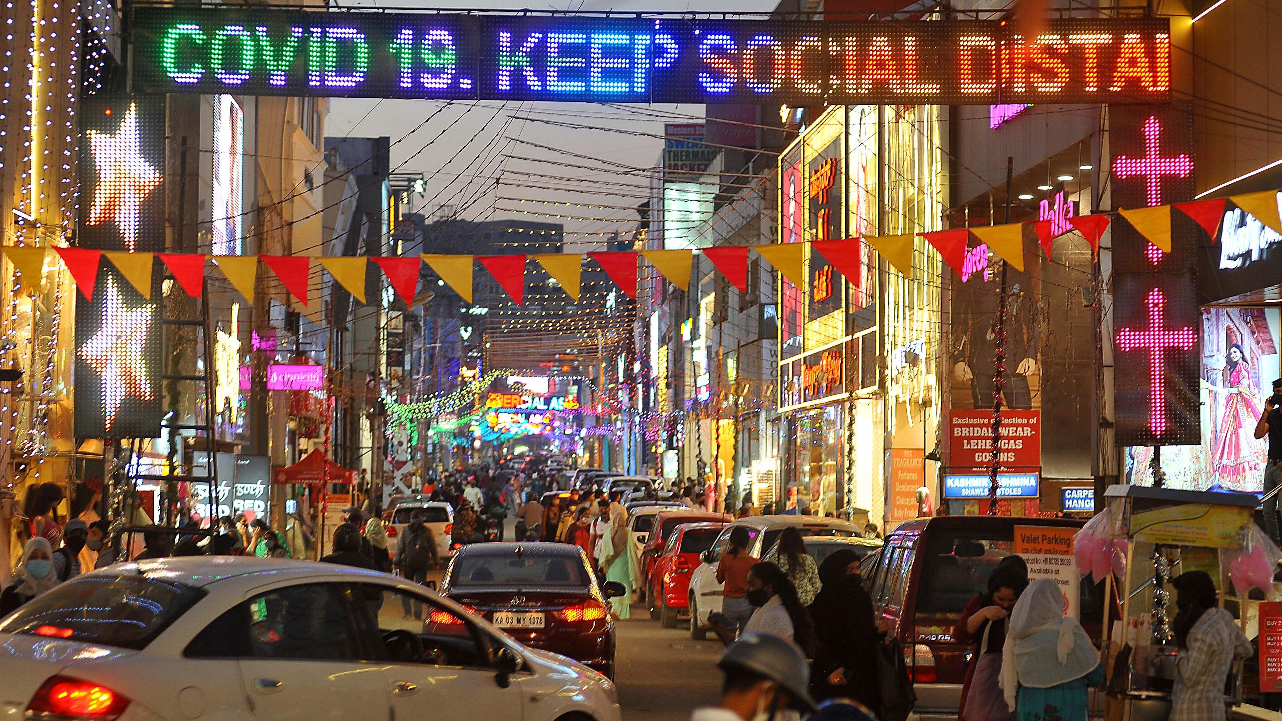 Commercial Street is lit up with colourful lights for New Year celebrations in Bengaluru on Wednesday. DH Photo/Pushkar V