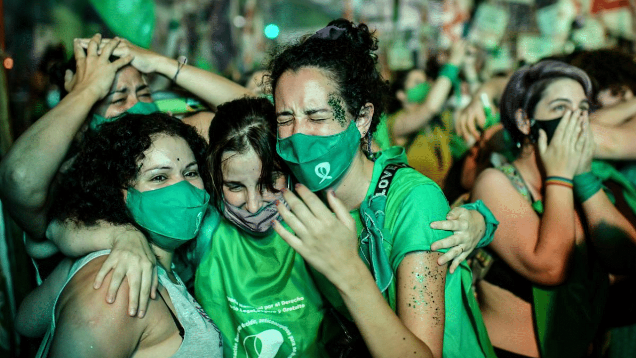 Pro-choice activists celebrate after the Senate approved a bill to legalize abortion outside the Congress in Buenos Aires. Credit: AFP