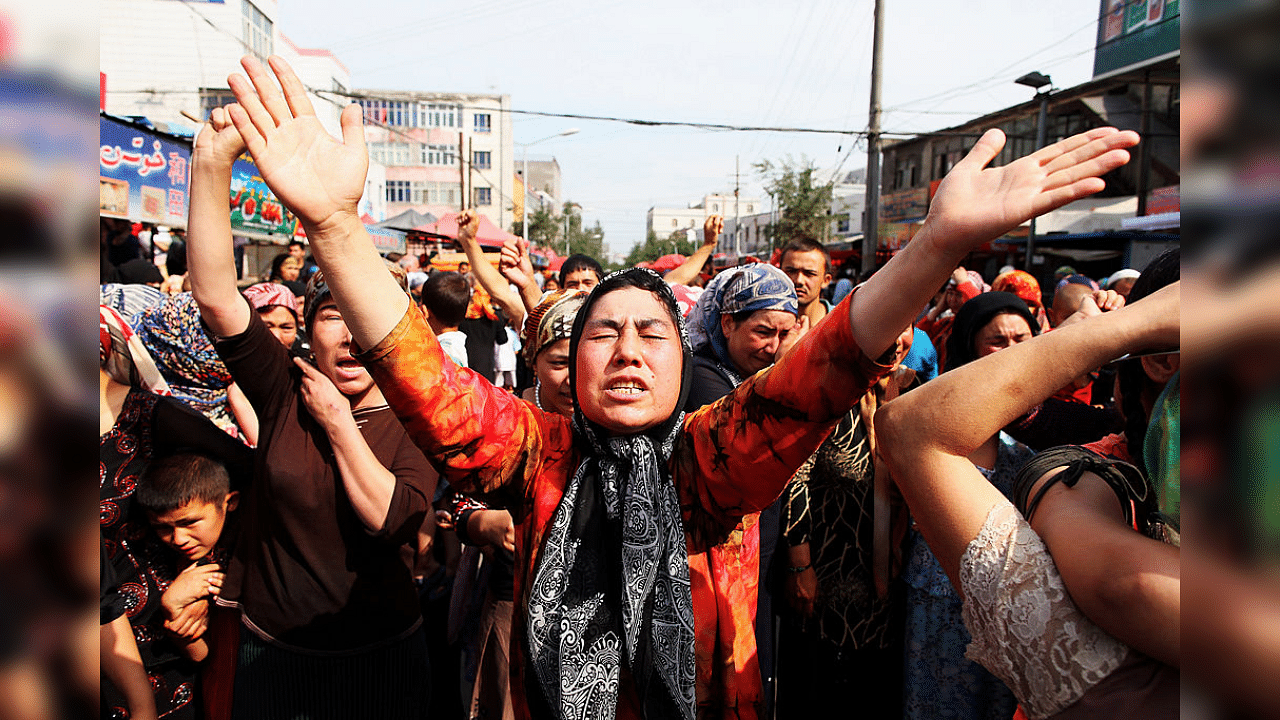 Uighur people protest at a street on July 7, 2009 in Urumqi, the capital of Xinjiang Uighur autonomous region, China. Credit: Getty Images