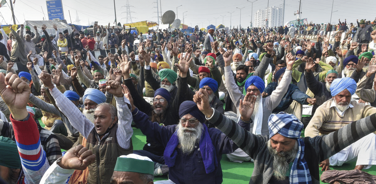 Farmers shout slogans during a protest against the new farm laws, at Ghazipur Delhi-UP border in Ghaziabad. Credit: PTI Photo