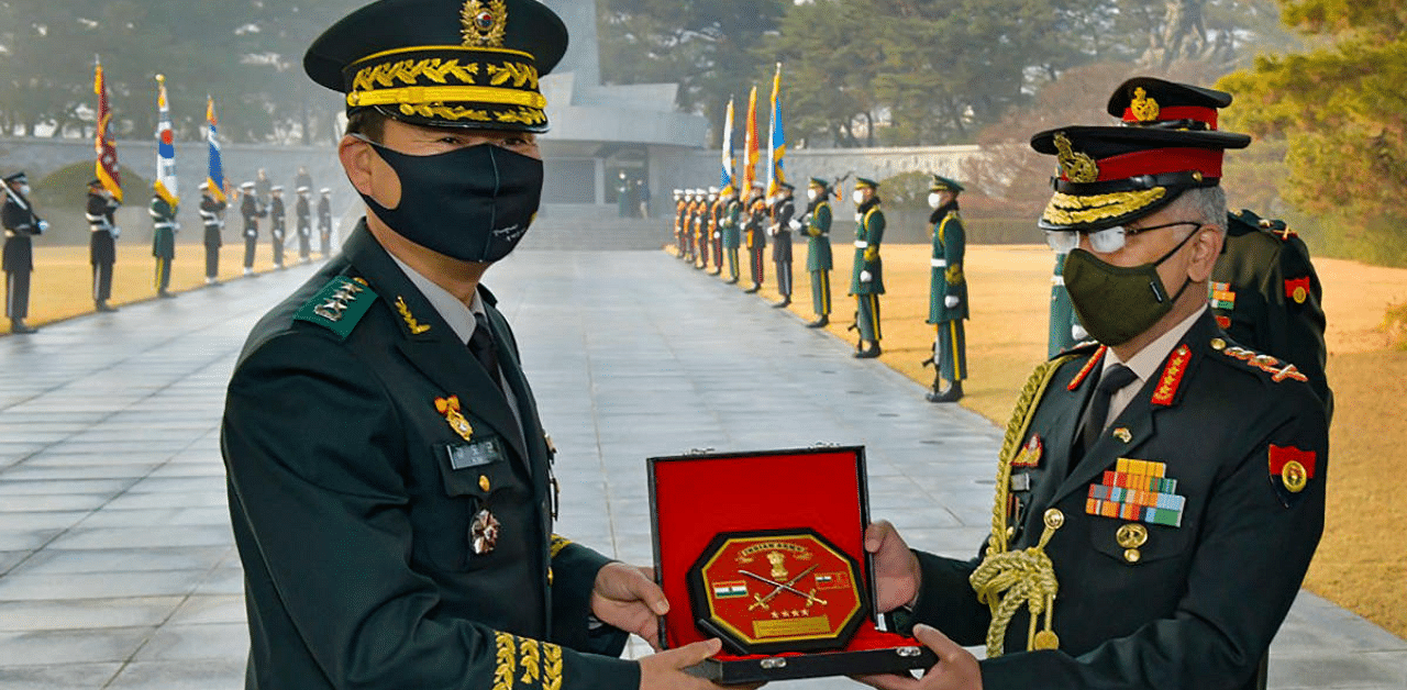 Indian Army Chief General MM Naravane receives a memento during his visit to 30th Armoured Brigade and DMZ, Republic of Korea. Credit: PTI Photo