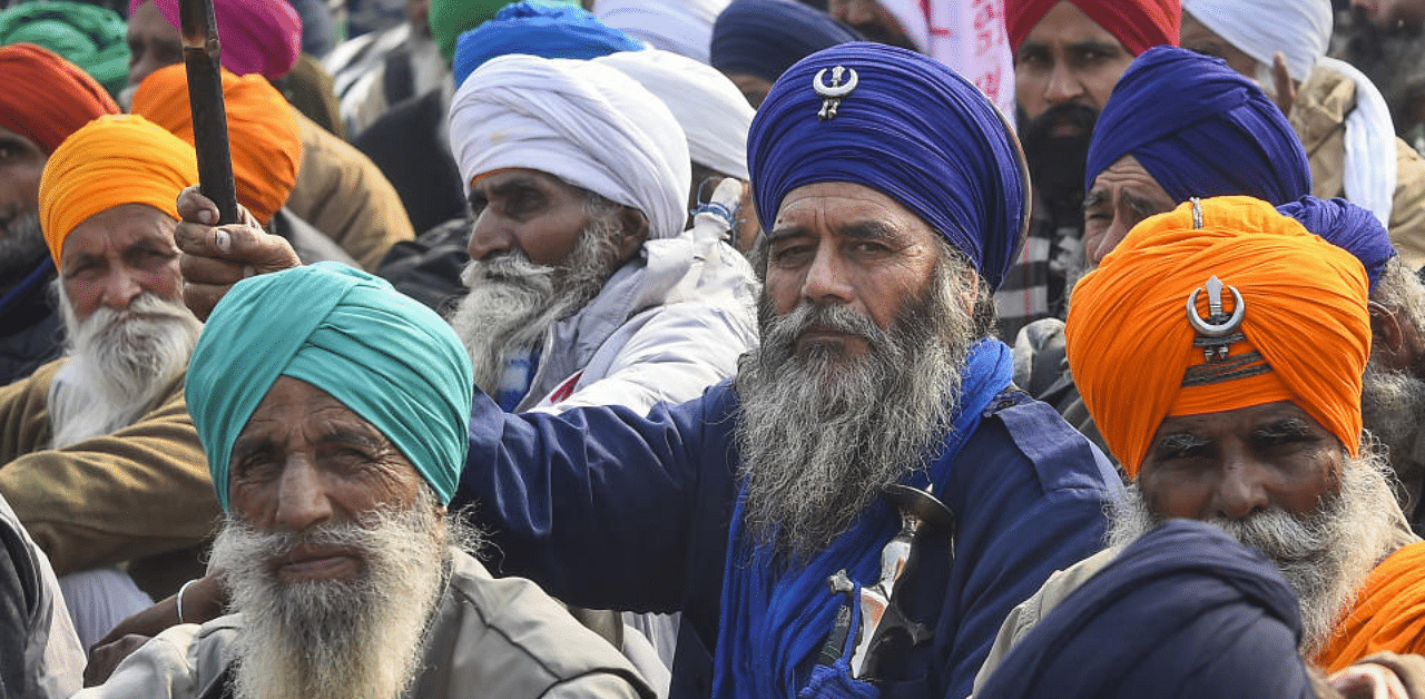 Farmers during their ongoing protest against new farm laws, at Singhu border in New Delhi, Thursday, Dec 31, 2020. Credit: PTI Photo