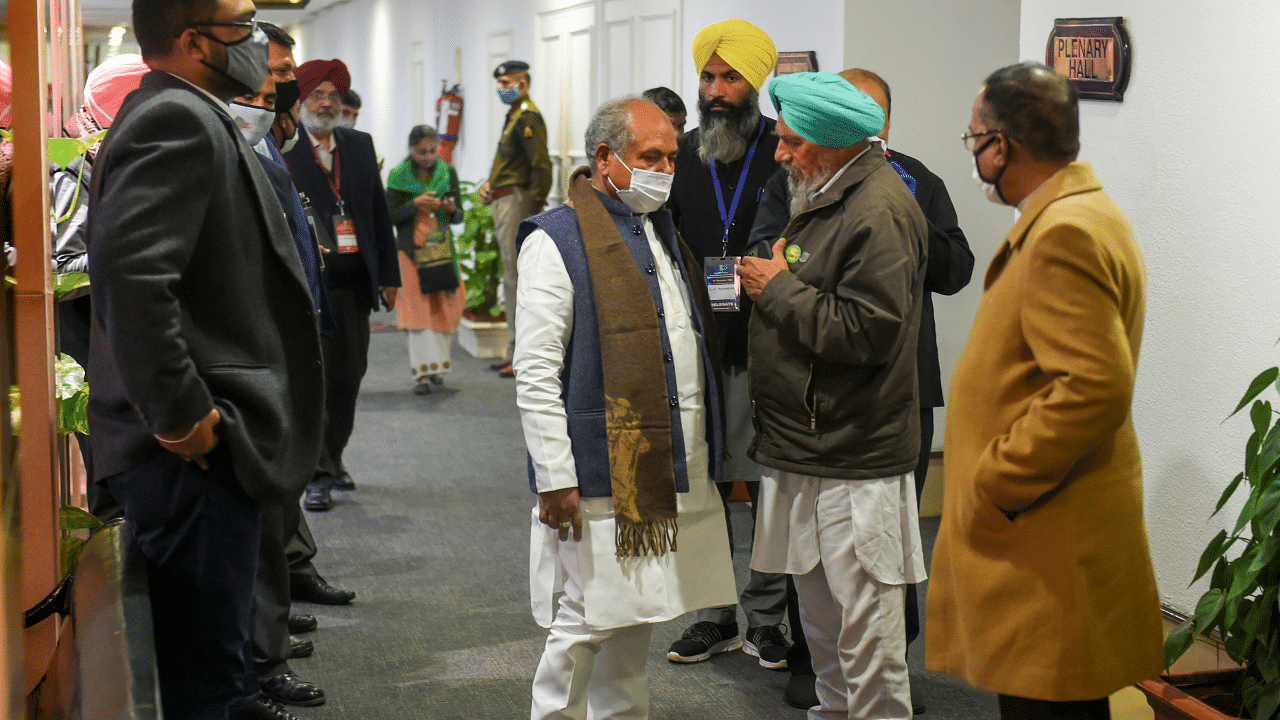 Union Agriculture Minister Narendra Singh Tomar interacts with a farmers' representative, at Vigyan Bhawan. Credit: PTI Photo