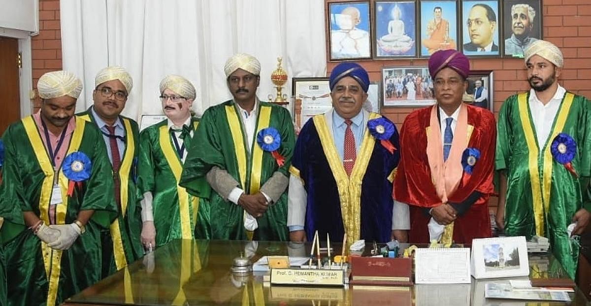 Dignitaries in colourful gowns with Mysuru-style turbans during the 100th convocation of the University of Mysore in Mysuru, on October 19, 2019. Vice-Chancellor G Hemantha Kumar is seen.
