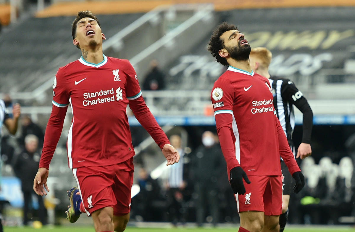 Liverpool's Mohamed Salah and Roberto Firmino react. Credit: Reuters. 