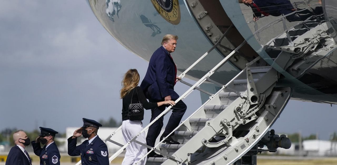 President Donald Trump and first lady Melania Trump board Air Force One at Palm Beach International Airport. Credit: AP/PTI.