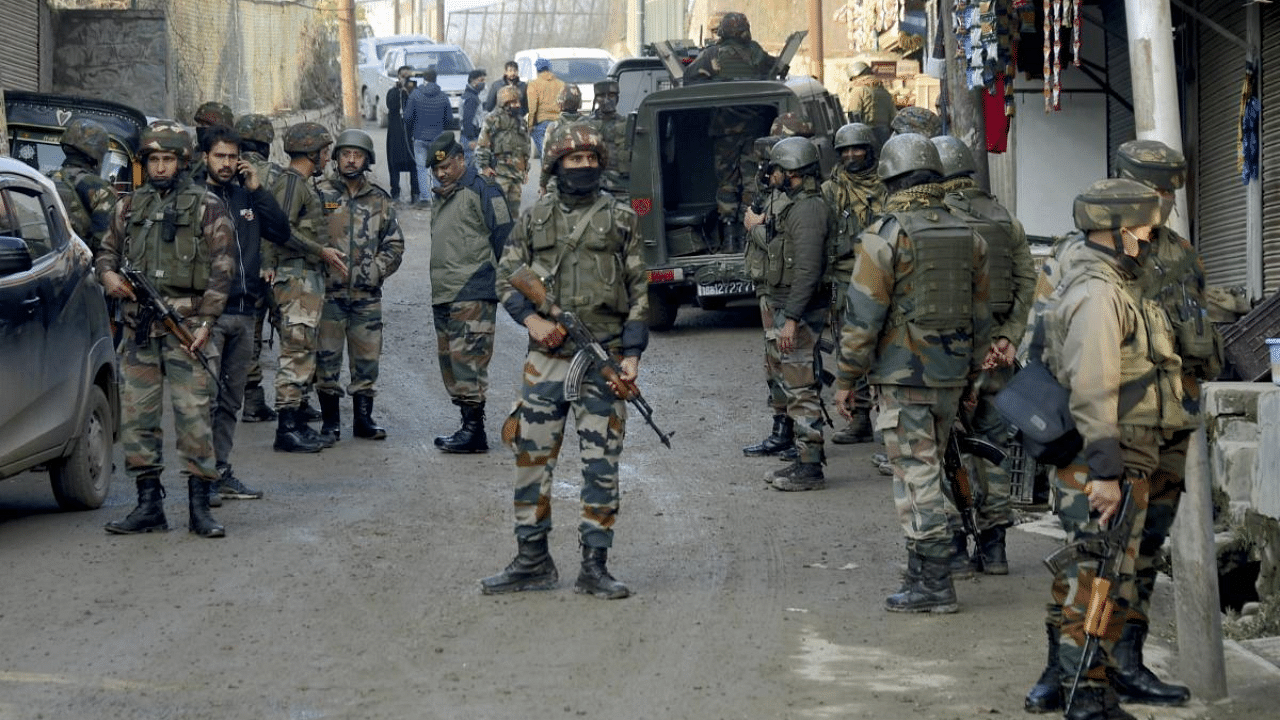 Senior Army officers investigate the site of a militant attack at Khushipora area of Parimpora, in Srinagar. Credit: PTI File Photo
