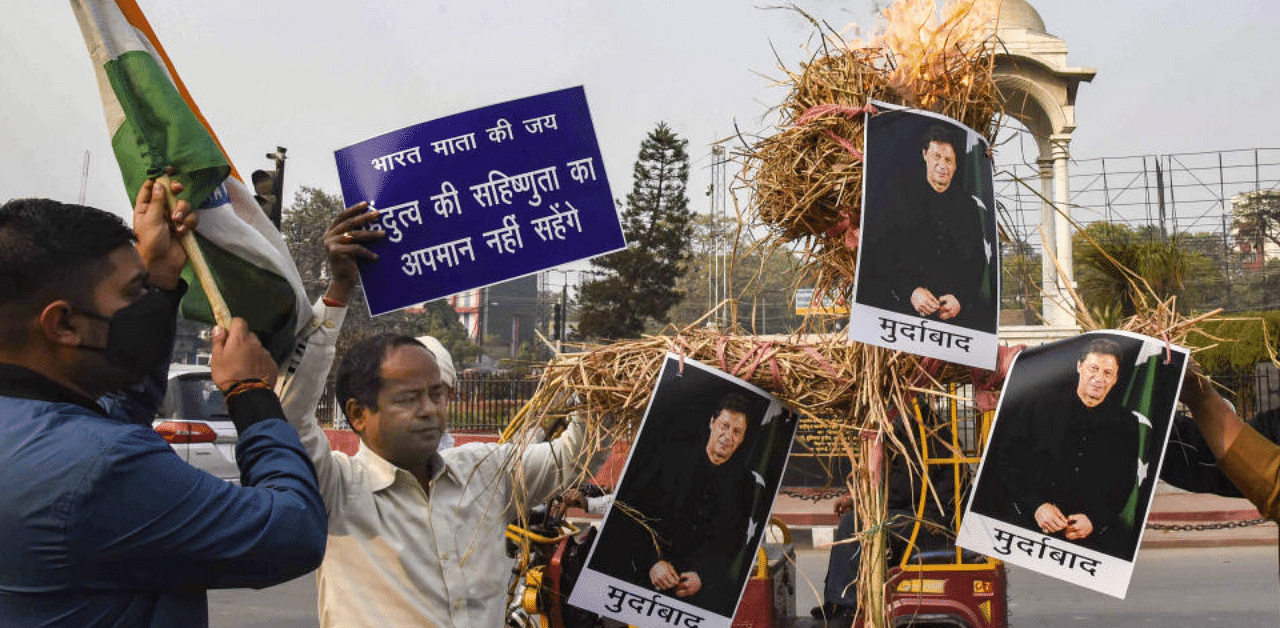 Lok Janshakti Party activists burn an effigy of Pakistan's Prime Minister Imran Khan during a protest aganist alleged attack on hindu temples in the country, in Patna, Thursday, Dec. 31, 2020. Credit: PTI Photo