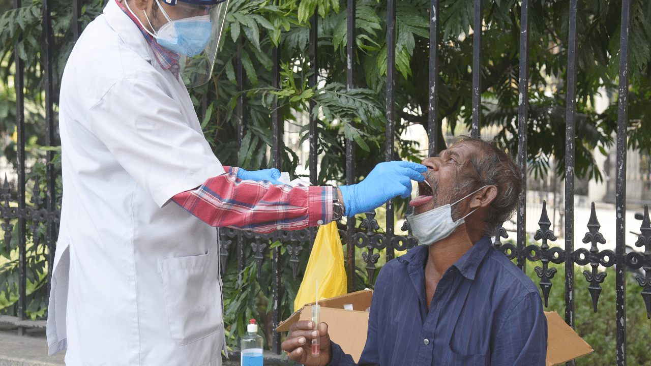 ASHA workers and Medical Staff collecting nasal swab for coronavirus test. Credit: DH Photo