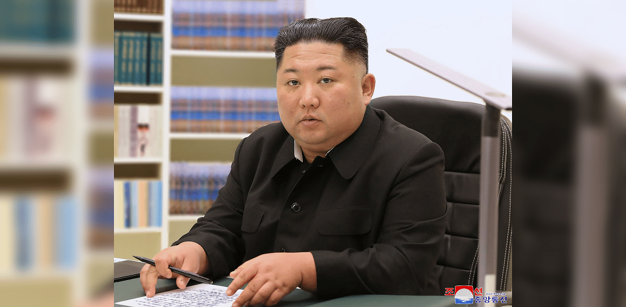 North Korean leader Kim Jong Un writing a handwritten letter to all the people in the 2021 New Year. Credit: AFP
