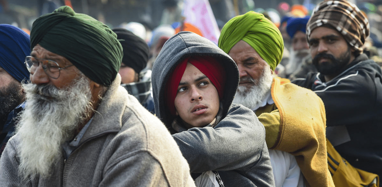Farmers during their ongoing protest against new farm laws, at Singhu border in New Delhi. Credit: PTI. 