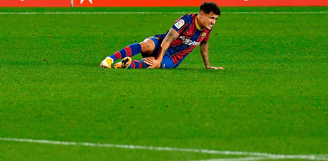 Barcelona's Brazilian midfielder Philippe Coutinho reacts after falling during the Spanish League football match between Barcelona and Eibar. Credit: AFP Photo