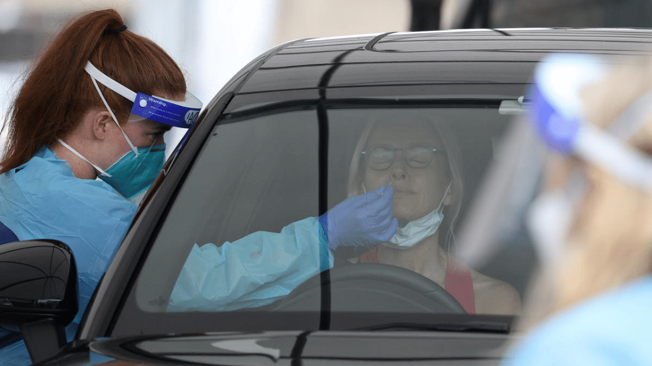 A medical worker swabs a member of the public at the Bondi Beach drive-through Covid-19 testing centre in Sydney, Australia. Credit: Reuters File Photo
