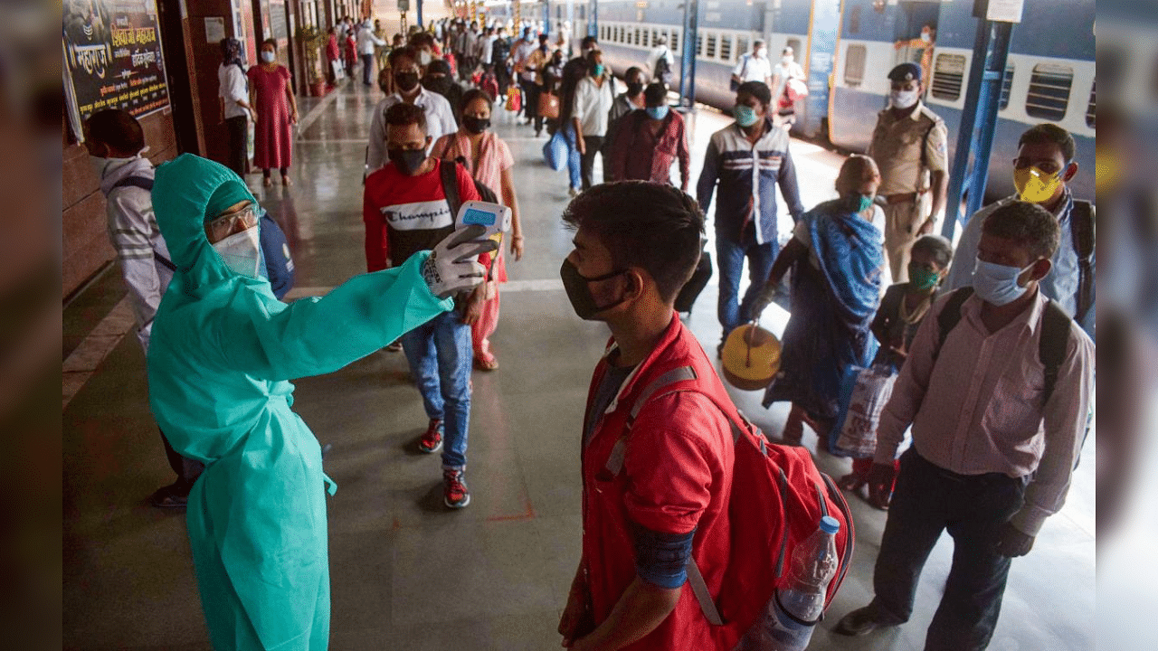 Migrant labours undergo thermal screening at Dadar railway station, in wake of the coronavirus pandemic, in Mumbai, Friday, July 31, 2020.  Credit: PTI Photo