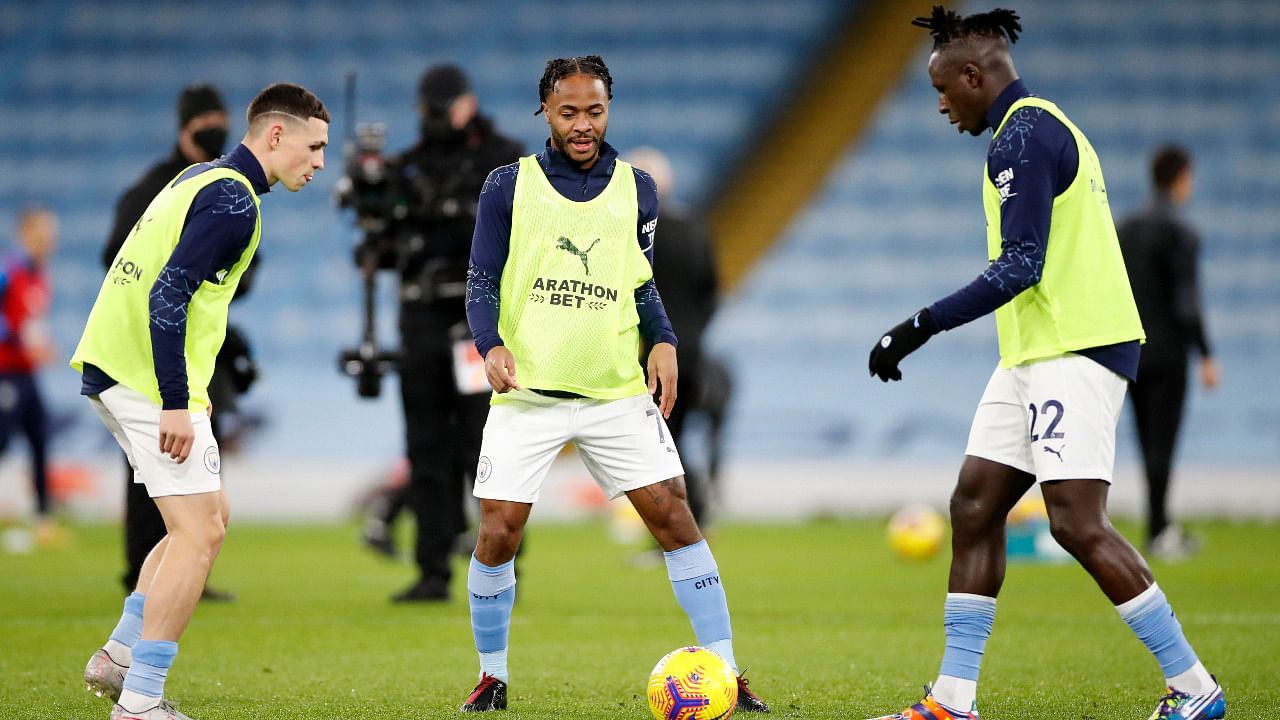 Manchester City's Phil Foden, Raheem Sterling and Benjamin Mendy during the warm up. Credit: Reuters Photo