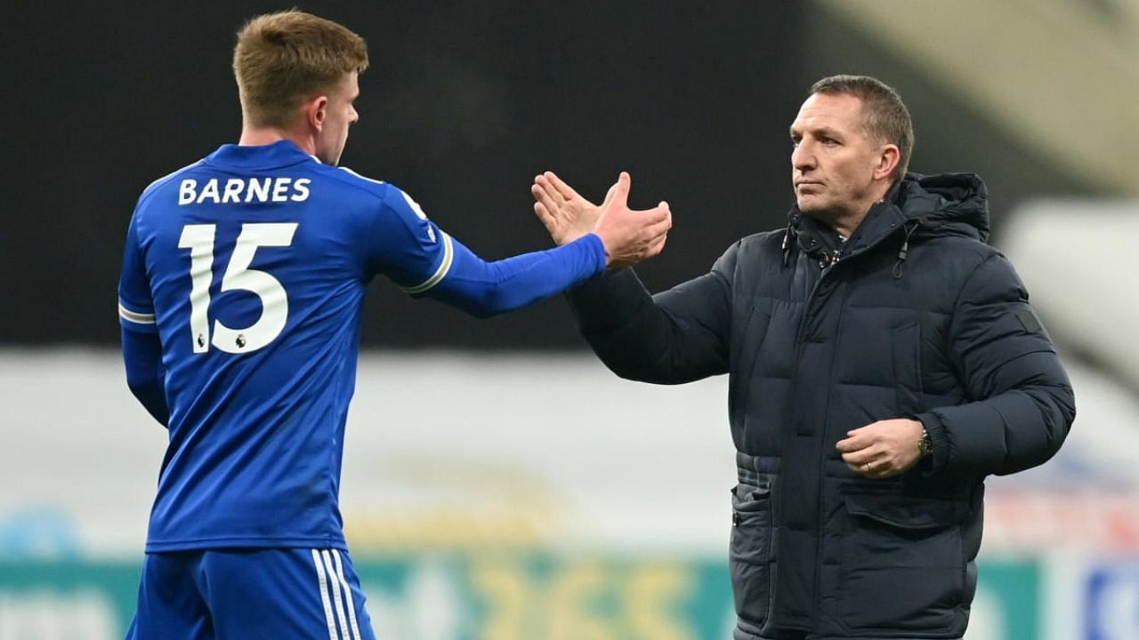 Leicester City manager Brendan Rodgers celebrates with Harvey Barnes. Credit: Reuters.