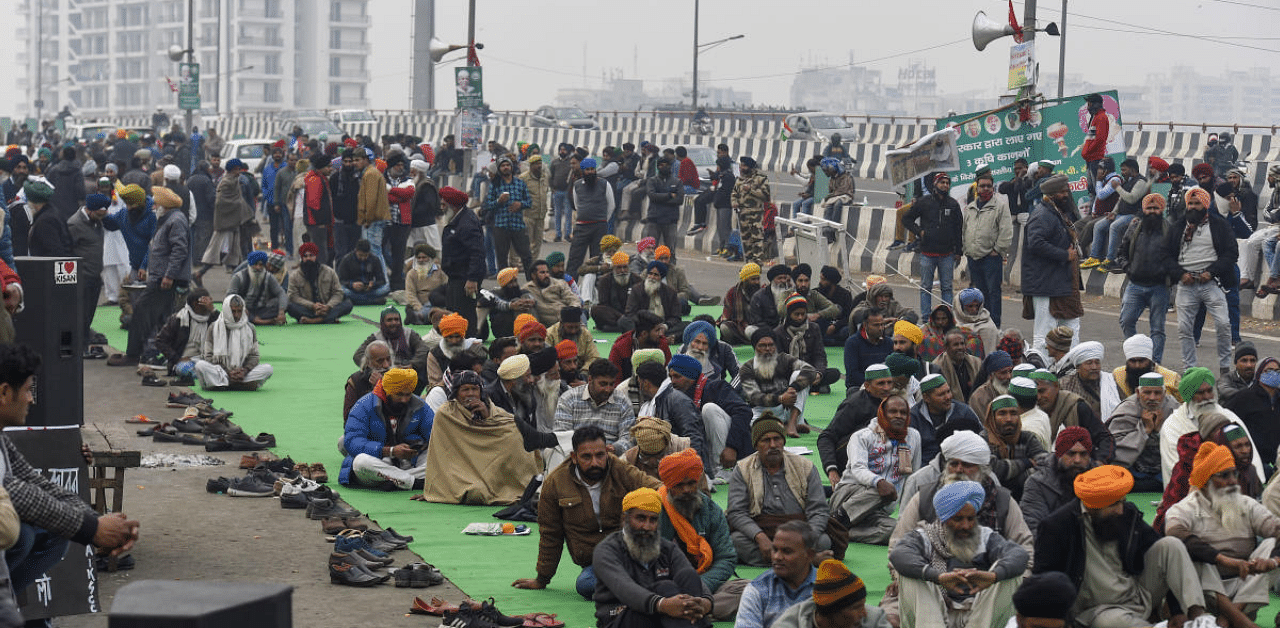  Farmers during their protest against the new farm laws, at Ghazipur border in New Delhi. Credit: PTI Photo