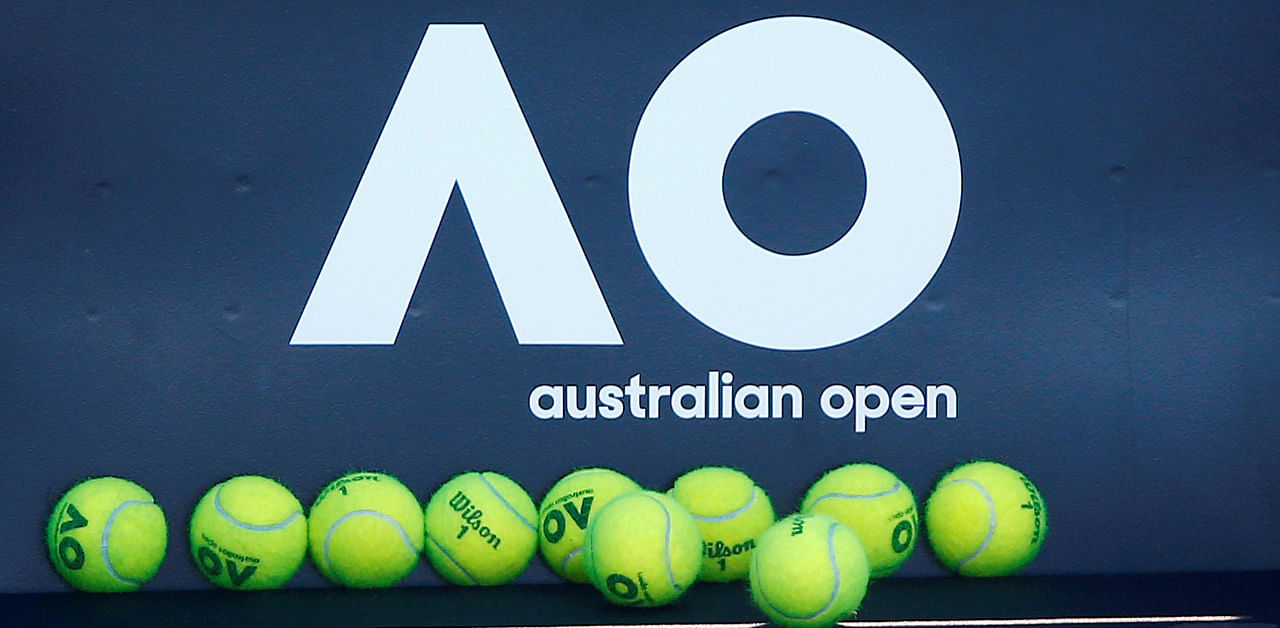 Tennis balls are pictured in front of the Australian Open logo before the tennis tournament. Credit: Reuters Photo