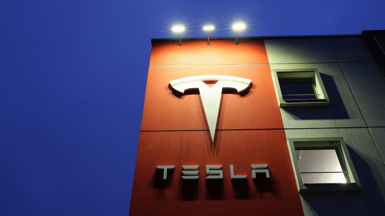 Logo of car manufacturer Tesla is seen at a branch office in Bern. Credit: Reuters Photo