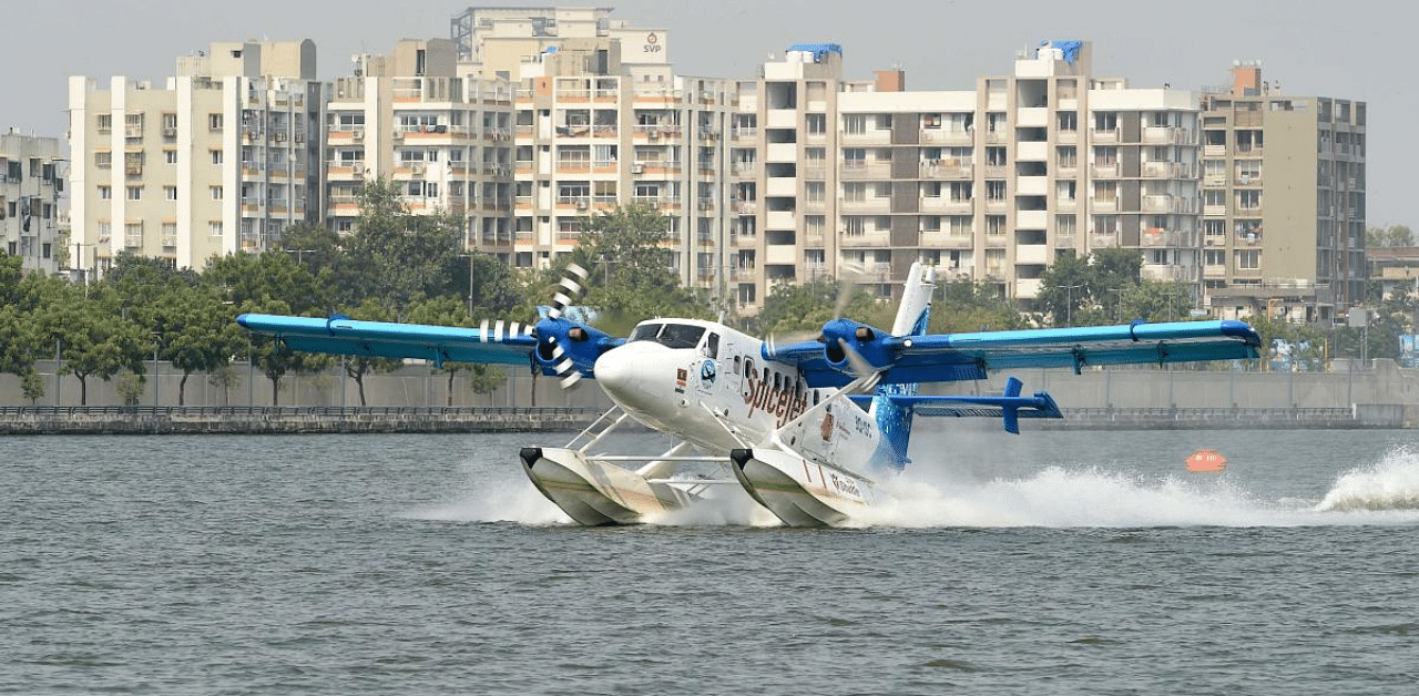 Prime Minister Narendra Modi (not seen) arrives on a seaplane during its launch between Kevadiya and Ahmedabad, at the Sabarmati Riverfront in Ahmedabad. Credit: AFP Photo