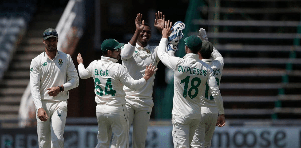 South Africa's Lungi Ngidi (C) celebrates with teammates after the dismissal of Sri Lanka's Kusal Perera during the second day of the second Test cricket match between South Africa and Sri Lanka at the Wanderers stadium in Johannesburg. Credit: AFP Photo