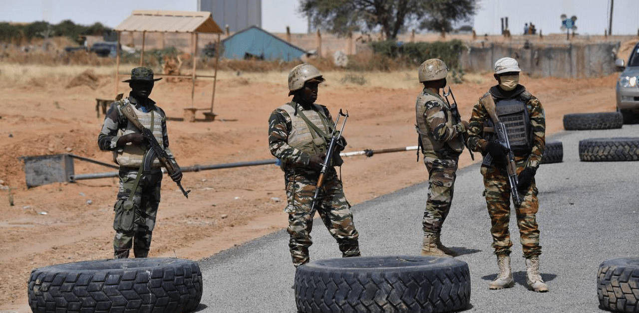 Nigerien soldiers stand guard outside the Diffa airport in South-East Niger, near the Nigerian border. Credit: AFP Photo