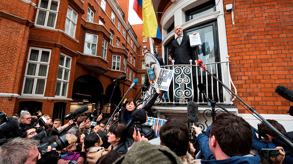 WikiLeaks founder Julian Assange (C) addresses media and supporters from the balcony of Ecuador's embassy in central London. Credit: AFP Photo